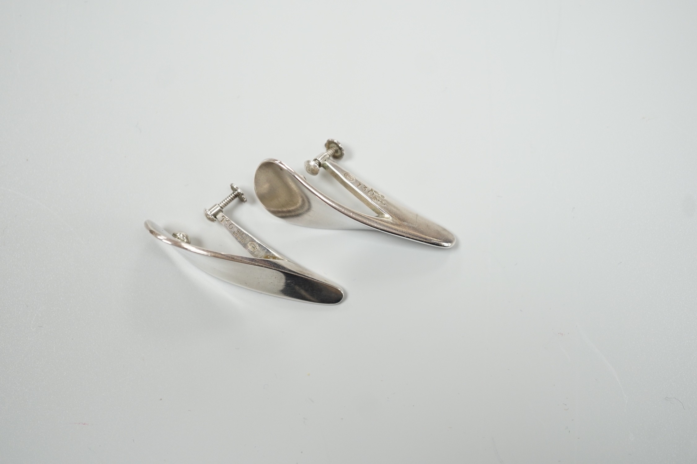 A pair of 1970's silver Georg Jensen curved teardrop shaped ear clips, design no. 130, 40mm.